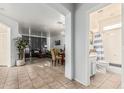 Open floor plan showcasing a living area, dining area, and a glimpse of a bathroom creating an ideal space for relaxation and entertainment at 6846 S 26Th Pl, Phoenix, AZ 85042