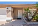 Inviting front entry with a decorative door, well-kept landscaping, and a clear house number at 823 N 81St St, Mesa, AZ 85207