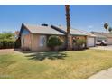 A single-story house with well-maintained lawn and desert landscaping is featured at 1407 W Chilton St, Chandler, AZ 85224