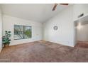 Bright living room with a large window and neutral carpet at 1407 W Chilton St, Chandler, AZ 85224