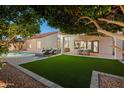 Inviting backyard with a swimming pool, lush landscaping, and outdoor seating areas for relaxation at 16238 N 58Th St, Scottsdale, AZ 85254