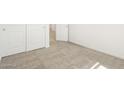 Bedroom featuring neutral carpet, white walls, closet and doorway, and ample natural light at 19406 N Fiano Dr, Maricopa, AZ 85138