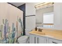 Bright bathroom with tiled shower, modern fixtures, and stylish vanity at 2946 N 14Th St # 3, Phoenix, AZ 85014