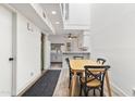 Bright dining area with seating for four, and open access to kitchen at 2946 N 14Th St # 3, Phoenix, AZ 85014