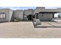 Modern home with a porte-cochere and desert landscaping at 38709 N 16Th Pl, Phoenix, AZ 85086