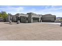 Contemporary home with desert landscaping and a spacious driveway at 38709 N 16Th Pl, Phoenix, AZ 85086