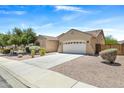 Attractive home showcasing a well-maintained lawn, desert landscaping, and a spacious driveway at 4093 E Westchester Dr, Chandler, AZ 85249