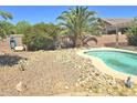 Private backyard with a pool and desert landscaping at 44583 W Sandstone Dr, Maricopa, AZ 85139