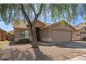 Inviting one-story home with a two-car garage and low-maintenance desert landscaping in a quiet residential setting at 7310 N 68Th Ln, Glendale, AZ 85303