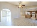 Inviting living room area with tile flooring and a seamless transition to the adjacent kitchen at 742 S Rose --, Mesa, AZ 85204