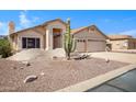 Inviting single-story home with a well-maintained desert landscape, adding character to the property at 10214 E Moonshadow Way, Gold Canyon, AZ 85118