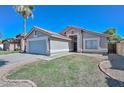 Charming single-story home with a well-manicured front yard and attached two-car garage on a sunny day at 11224 W Puget Ave, Peoria, AZ 85345