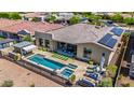 Spacious backyard features a pool, spa, covered patios, desert landscaping for luxurious living at 11796 W Creosote Dr, Peoria, AZ 85383