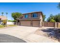 Desirable two-story home with three-car garage, desert landscaping, side gate, and paver driveway at 1204 S Arroya Cir, Mesa, AZ 85206