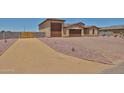 Inviting single-Gathering home with a desert rock yard, RV gate, and multi-car garage at 29408 N 224Th Dr, Wittmann, AZ 85361