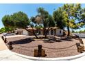 Beautiful home with a low-maintenance front yard and unique decorative wooden posts and chain fencing at 5302 W Poinsettia Dr, Glendale, AZ 85304