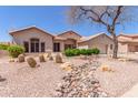 Beautiful desert home featuring rocks, cacti, and desert landscaping at 5372 S Cat Claw Dr, Gold Canyon, AZ 85118