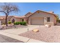 Inviting single-level home showcasing a 2-car garage and desert landscaping at 5372 S Cat Claw Dr, Gold Canyon, AZ 85118