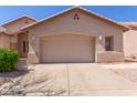 Spacious two-car garage with an arched entry and neutral color palette at 5372 S Cat Claw Dr, Gold Canyon, AZ 85118