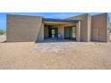 Covered patio with tiled floor, offering a relaxing outdoor space with seating at 553 W Cavalry Rd, New River, AZ 85087