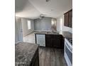 Stylish kitchen featuring a large island, granite countertops, and ample cabinet space at 625 W Mckellips Rd # 325, Mesa, AZ 85201