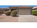 Charming single-story home featuring a well-maintained yard and two-car garage at 664 W Silver Reef Ct, Casa Grande, AZ 85122