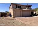 This property features a three-car garage plus additional parking at 6904 E Trailridge Cir, Mesa, AZ 85207
