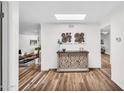 Bright entryway with stylish decor, wood floors, and views to the living and dining areas at 7832 E Via Marina --, Scottsdale, AZ 85258