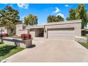 Inviting single-level home featuring a two-car garage, desert landscaping, and a stucco exterior at 7832 E Via Marina --, Scottsdale, AZ 85258