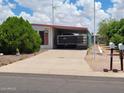Single-story home with a covered carport and desert landscaping at 901 S Esperanza Ave, Mesa, AZ 85208