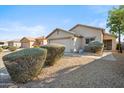 Charming single-Gathering home with a well-manicured front yard and a two-car garage at 9422 W Monroe St, Peoria, AZ 85345