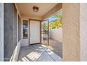 Welcoming front porch with a security screen door that leads into the home at 9422 W Monroe St, Peoria, AZ 85345