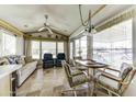 Bright and airy living area with a dining set, comfortable seating, and plenty of natural light at 17200 W Bell Rd # 812, Surprise, AZ 85374