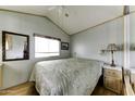Bedroom showcasing a large bed, window, built-in cabinets and an ample mirror on the left at 17200 W Bell Rd # 812, Surprise, AZ 85374