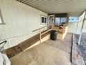 Comfortable and accessible front access entryway with welcome mat, ramp and flower pot at 18026 N Cave Creek Rd # 16, Phoenix, AZ 85032