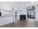 Bright living room with fireplace and expansive windows at 2333 E Southern Ave # 1015, Tempe, AZ 85282