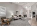 Inviting living room with plantation shutters, vaulted ceiling, neutral paint, and an open floor plan for easy entertaining at 4202 E Broadway Rd # 130, Mesa, AZ 85206