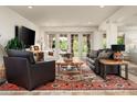 Bright living room with a large sliding glass door and comfortable seating, creating an inviting atmosphere at 8068 E Del Trigo Rd, Scottsdale, AZ 85258