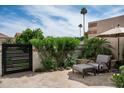 Cozy outdoor patio featuring comfortable seating, mature trees, and a serene atmosphere perfect for relaxing at 8068 E Del Trigo Rd, Scottsdale, AZ 85258