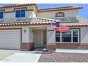 Inviting front exterior showcasing solar panels and an American flag at 10806 W Adam Ave, Peoria, AZ 85373