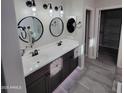 Stylish bathroom featuring double sinks, vanity, and modern fixtures at 1352 W Spine Tree Ave, Queen Creek, AZ 85140