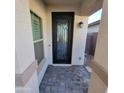 Inviting front door with decorative glass, situated on a paved walkway for added curb appeal at 1352 W Spine Tree Ave, Queen Creek, AZ 85140