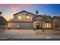 Charming two-story home featuring a three-car garage, well-kept yard, and covered entry at 13626 N 89Th St, Scottsdale, AZ 85260