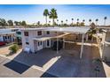 Single Gathering home featuring a covered parking area, cozy front patio, and desert landscaping at 17200 W Bell Rd # 1801, Surprise, AZ 85374