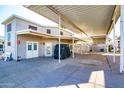 Exterior view of a home highlighting the carport, landscape, and well-maintained surroundings at 17200 W Bell Rd # 1801, Surprise, AZ 85374