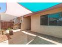 Cozy, shaded back patio with privacy fence at 1822 S River Dr, Tempe, AZ 85281