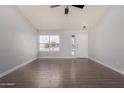 Spacious living room showcases wood-look floors and neutral paint at 19802 N 3Rd Ave, Phoenix, AZ 85027