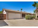 Single-story home showcasing a spacious two-car garage and easy-care landscaping at 2018 W Taro Ln, Phoenix, AZ 85027
