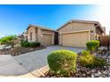 The exterior showcases a desert-style landscape with a paver driveway and muted exterior paint at 23448 N 76Th Pl, Scottsdale, AZ 85255