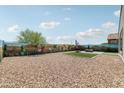 Desert landscaped backyard with low maintenance gravel and artificial turf sections at 25727 N 161St Ave, Surprise, AZ 85387